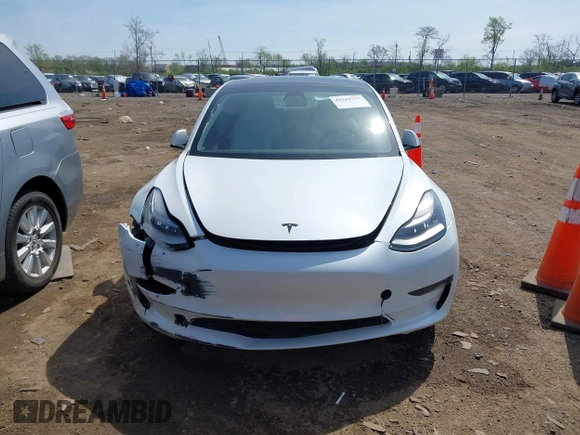 2020 Tesla Model 3 Standard Range Plus with VIN 5YJ3E1EA3LF785951, listed as a IAAI auction lot 41919339 with 63,025 mi miles and . Bid and sale history available at carsss.com. Image 11.