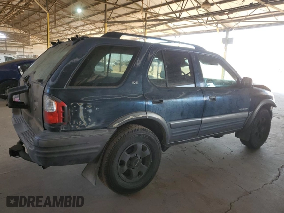 2001 Isuzu Rodeo S with VIN 4S2CK58W614344850, listed as a Copart auction lot 63807664 with 176,203 mi miles and Salvage title. Bid and sale history available at DreamBid. Image 3.