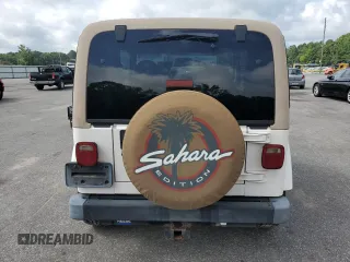 1999 Jeep Wrangler Sahara z VIN 1J4FY49S0XP432968, wystawiony jako Copart lot #65033715 z przebiegiem 126 420 mil mil oraz Szkoda całkowita • Salvage title. Historia ofert i sprzedaży dostępna na DreamBid. Obrazek 6.