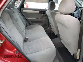 2004 Suzuki Forenza S z VIN KL5JD52Z94K061669, wystawiony jako Copart lot #81585854 z przebiegiem 80 186 mil mil oraz Szkody całkowita. Historia ofert i sprzedaży dostępna na DreamBid. Obrazek 10.
