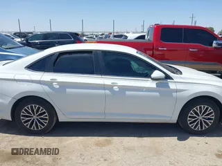 2021 Volkswagen Jetta S z VIN 3VWC57BU8MM035618, wystawiony jako IAAI lot #41998464 z przebiegiem 56 099 mil mil oraz . Historia ofert i sprzedaży dostępna na DreamBid. Obrazek 13.