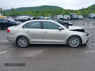 2014 Volkswagen Jetta TDI w/Premium/Nav with VIN 3VWLL7AJ9EM226026, listed as a IAAI auction lot 42219871 with 100,386 mi miles and . Bid and sale history available at DreamBid. Image 13.