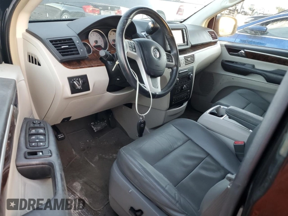 2013 Volkswagen Routan z VIN 2C4RVADG8DR725749, wystawiony jako Copart lot #77624324 z przebiegiem 156 557 mil mil oraz Czysty tytuł • Clean title. Historia ofert i sprzedaży dostępna na DreamBid. Obrazek 8.