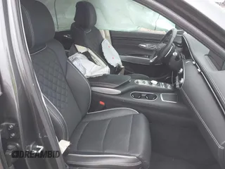 2023 Genesis GV70 Advanced z VIN 5NMMCET18PH000249, wystawiony jako IAAI lot #42013729 z przebiegiem 22 282 mil mil oraz . Historia ofert i sprzedaży dostępna na DreamBid. Obrazek 5.