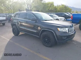 2011 Jeep Grand Cherokee 70th Anniversary with VIN 1J4RR4GG1BC588848, listed as a IAAI auction lot 42117042 with 168,273 mi miles. Bid and sale history available at carsss.com. Image 1.