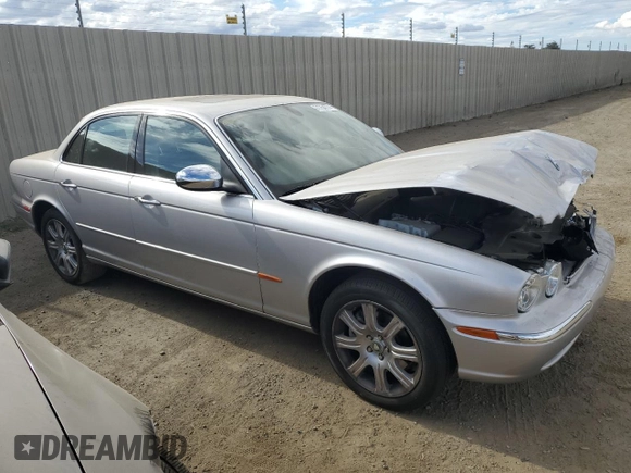 2004 Jaguar XJ with VIN SAJEA74C34SG09548, listed as a Copart auction lot 71754774 with 142,804 mi miles and Salvage Title. Bid and sale history available at DreamBid. Image 4.