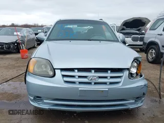 2003 Hyundai Accent GL with VIN KMHCG35C23U264360, listed as a IAAI auction lot 42033316 with 100,991 mi miles. Bid and sale history available at carsss.com. Image 12.
