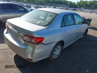 2011 Toyota Corolla L with VIN 2T1BU4EE9BC713402, listed as a IAAI auction lot 42044806 with 121,894 mi miles. Bid and sale history available at carsss.com. Image 4.