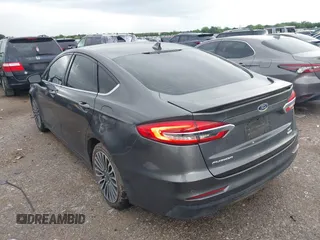 2020 Ford Fusion SE z VIN 3FA6P0HD5LR198744, wystawiony jako IAAI lot #42177820 z przebiegiem 97 520 mil mil oraz . Historia ofert i sprzedaży dostępna na DreamBid. Obrazek 3.