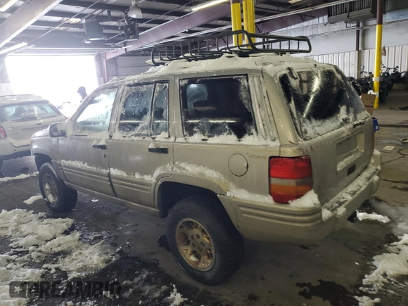 1997 Jeep Grand Cherokee Limited with VIN 1J4GZ78Y1VC706353, listed as a Copart auction lot 41437085 with 163,675 mi miles and Salvage Title. Bid and sale history available at carsss.com. Image 2.