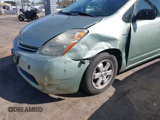 2007 Toyota Prius z VIN JTDKB20U877556527, wystawiony jako IAAI lot #41965245 z przebiegiem 259 572 mil mil oraz . Historia ofert i sprzedaży dostępna na DreamBid. Obrazek 6.