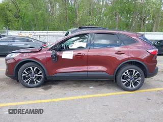 2021 Ford Escape SE Hybrid with VIN 1FMCU9BZ9MUA15592, listed as a IAAI auction lot 42261312 with 56,525 mi miles and . Bid and sale history available at DreamBid. Image 14.