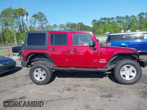 2011 Jeep Wrangler Unlimited Sport with VIN 1J4BA3H18BL598323, listed as a IAAI auction lot 41958043 with 154,354 mi miles. Bid and sale history available at carsss.com. Image 13.
