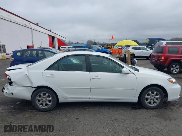2002 Toyota Camry LE z VIN 4T1BE32K52U081479, wystawiony jako IAAI lot #41344104 z przebiegiem 243 950 mil mil oraz . Historia ofert i sprzedaży dostępna na DreamBid. Obrazek 13.