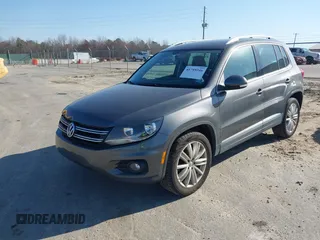 2012 Volkswagen Tiguan SE with VIN WVGAV7AX5CW000275, listed as a IAAI auction lot 41789246 with 123,618 mi miles and . Bid and sale history available at DreamBid. Image 2.