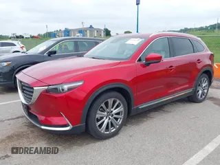 2021 Mazda CX-9 Signature with VIN JM3TCBEY9M0511928, listed as a IAAI auction lot 42231925 with 26,367 mi miles and . Bid and sale history available at DreamBid. Image 2.