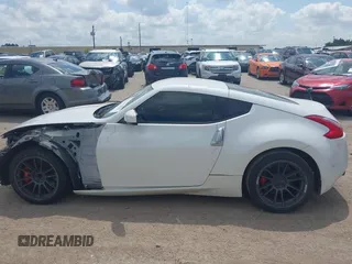 2012 Nissan 370Z z VIN JN1AZ4EH5CM564517, wystawiony jako IAAI lot #42385869 z przebiegiem 55 359 mil mil oraz . Historia ofert i sprzedaży dostępna na DreamBid. Obrazek 15.