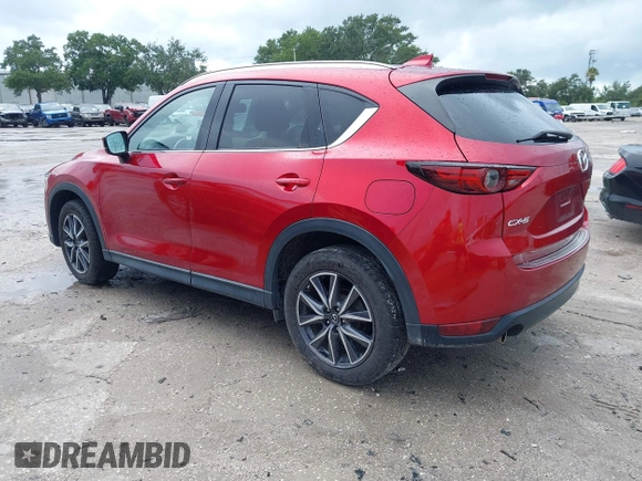 2018 Mazda CX-5 Grand Touring with VIN JM3KFADM5J0437365, listed as a IAAI auction lot 42657919 with 96,760 mi miles and . Bid and sale history available at DreamBid. Image 3.