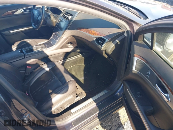2014 Lincoln MKZ z VIN 3LN6L2J97ER835137, wystawiony jako IAAI lot #42062405 z przebiegiem 281 924 mil mil oraz . Historia ofert i sprzedaży dostępna na DreamBid. Obrazek 5.