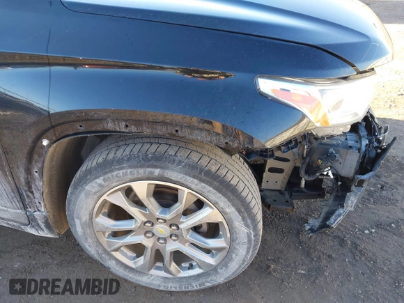 2018 Chevrolet Traverse Premier z VIN 1GNEVJKW5JJ174261, wystawiony jako IAAI lot #41656906 z przebiegiem 101 908 mil mil oraz . Historia ofert i sprzedaży dostępna na DreamBid. Obrazek 19.