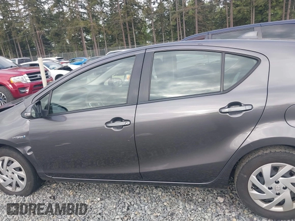2015 Toyota Prius One z VIN JTDKDTB32F1575905, wystawiony jako IAAI lot #42152447 z przebiegiem 141 061 mil mil oraz . Historia ofert i sprzedaży dostępna na DreamBid. Obrazek 14.