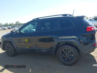 2016 Jeep Cherokee Trailhawk with VIN 1C4PJMBB9GW179051, listed as a IAAI auction lot 42520342 with 100,538 mi miles and . Bid and sale history available at DreamBid. Image 14.