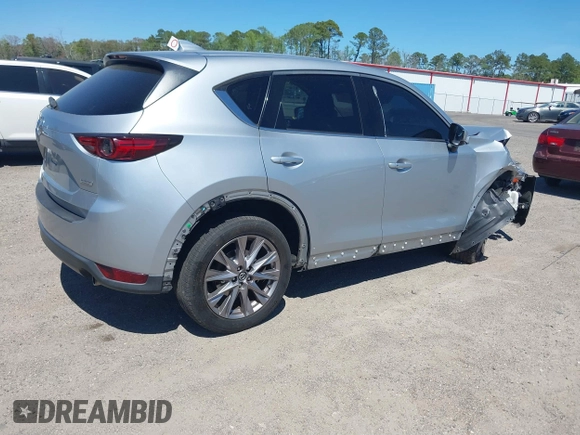2019 Mazda CX-5 Grand Touring with VIN JM3KFADM1K1606082, listed as a IAAI auction lot 41875878 with 66,089 mi miles. Bid and sale history available at carsss.com. Image 4.