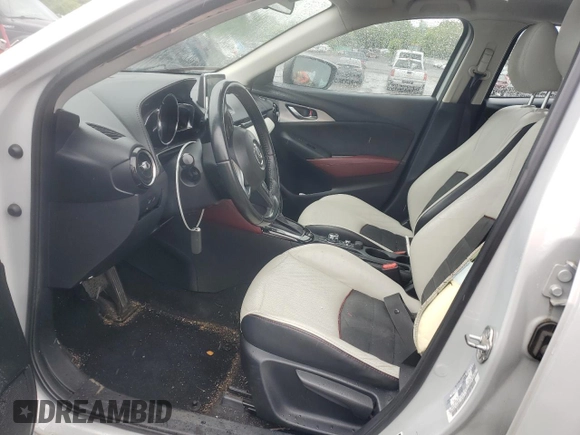 2016 Mazda CX-3 Grand Touring z VIN JM1DKBD77G0105451, wystawiony jako Copart lot #58341495 z przebiegiem 109 525 mil mil oraz Szkody całkowita. Historia ofert i sprzedaży dostępna na DreamBid. Obrazek 7.