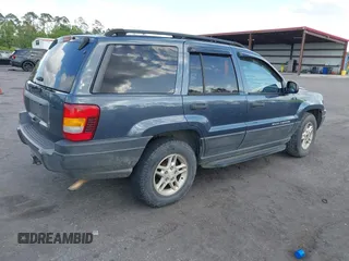 2004 Jeep Grand Cherokee Laredo with VIN 1J4GW48S24C101792, listed as a IAAI auction lot 41995351 with 138,317 mi miles. Bid and sale history available at carsss.com. Image 4.