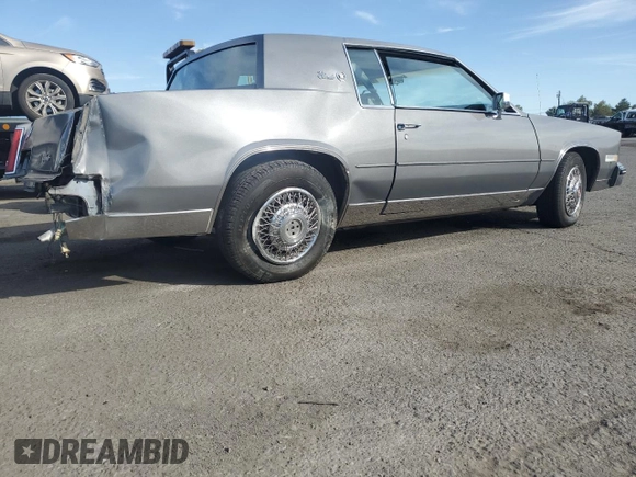 1985 Cadillac Eldorado z VIN 1G6EL5786FE628861, wystawiony jako Copart lot #76372384 z przebiegiem 15 146 mil mil oraz Szkody całkowita. Historia ofert i sprzedaży dostępna na DreamBid. Obrazek 3.