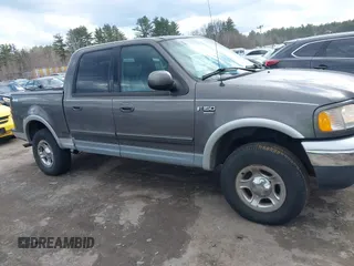 2003 Ford F-150 XLT with VIN 1FTRW08L63KA37275, listed as a IAAI auction lot 41875128 with 133,257 mi miles. Bid and sale history available at carsss.com. Image 13.