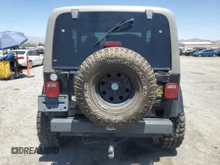 1999 Jeep Wrangler Sahara with VIN 1J4FY49S8XP472733, listed as a Copart auction lot 58174915 with 170,838 mi miles and Salvage title. Bid and sale history available at DreamBid. Image 6.