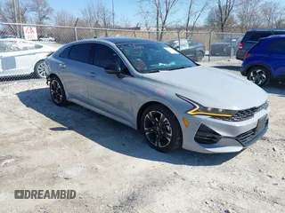 2022 Kia K5 GT-Line z VIN 5XXG64J26NG139110, wystawiony jako IAAI lot #42014932 z przebiegiem 69 798 mil mil oraz . Historia ofert i sprzedaży dostępna na DreamBid. Obrazek 1.