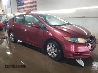 2010 Honda Insight LX with VIN JHMZE2H52AS034613, listed as a Copart auction lot 52701795 with 232,541 mi miles and Salvage Title. Bid and sale history available at DreamBid. Image 4.