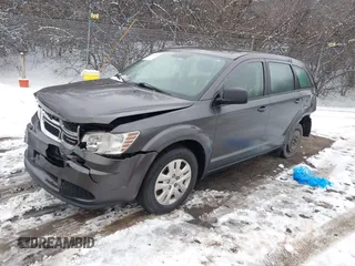2014 Dodge Journey SE with VIN 3C4PDCAB0ET182376, listed as a IAAI auction lot 41569006 with 106,024 mi miles and . Bid and sale history available at DreamBid. Image 2.