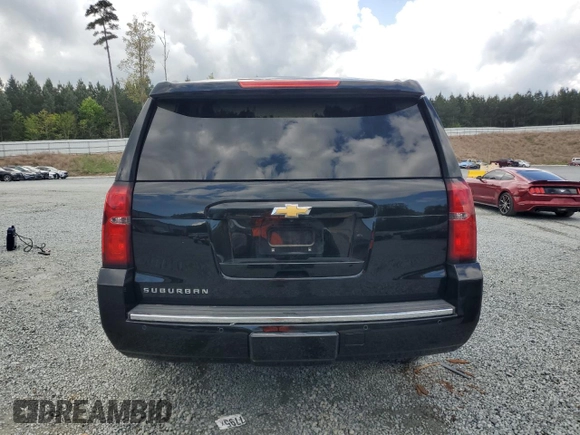 2015 Chevrolet Suburban LTZ with VIN 1GNSKKKC4FR119803, listed as a Copart auction lot 51416775 with 135,366 mi miles and Salvage Title. Bid and sale history available at DreamBid. Image 6.