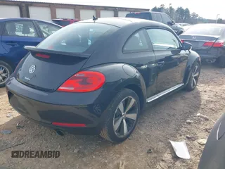 2012 Volkswagen Beetle 2.0T Turbo w/Sun/Snd/Nav PZEV with VIN 3VWVA7AT4CM655068, listed as a IAAI auction lot 41605197 with 115,546 mi miles. Bid and sale history available at carsss.com. Image 4.