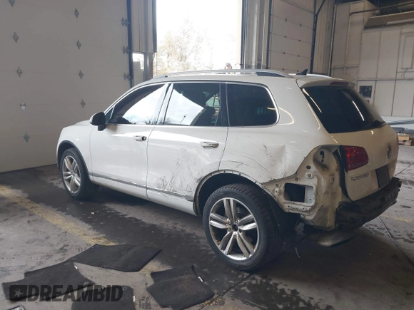 2013 Volkswagen Touareg Lux with VIN WVGEF9BP6DD007323, listed as a IAAI auction lot 41488959 with 123,383 mi miles and . Bid and sale history available at DreamBid. Image 3.