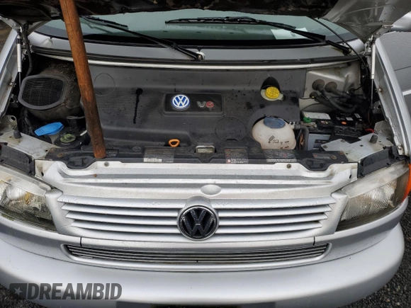 2001 Volkswagen EuroVan MV с VIN WV2MB47031H098986, выставлен на аукционе Copart как лот 77587294 с пробегом 161 046 миль миль и Чистый • Clean title. История ставок и продаж доступна на DreamBid. Изображение 12.
