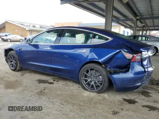 2020 Tesla Model 3 Standard Range Plus with VIN 5YJ3E1EA1LF631139, listed as a Copart auction lot 49161805 with 58,140 mi miles and Salvage Title. Bid and sale history available at DreamBid. Image 2.