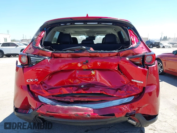 2021 Mazda CX-5 Grand Touring with VIN JM3KFADM5M0470483, listed as a IAAI auction lot 42785031 with 30,749 mi miles and . Bid and sale history available at DreamBid. Image 6.