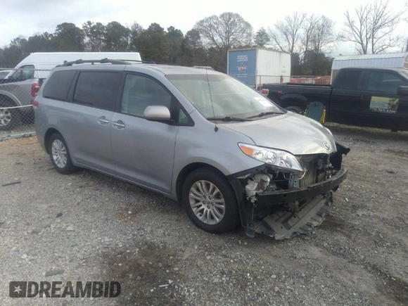 2014 Toyota Sienna XLE with VIN 5TDYK3DC0ES421501, listed as a IAAI auction lot 41672414 with 111,911 mi miles. Bid and sale history available at carsss.com. Image 1.