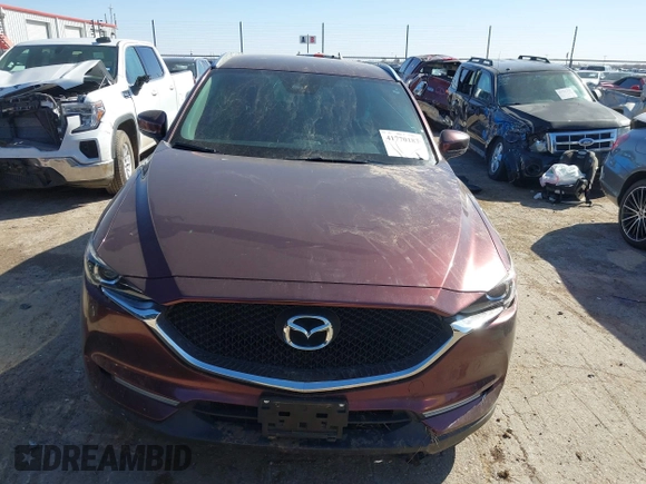 2019 Mazda CX-5 Sport with VIN JM3KFABM2K0686372, listed as a IAAI auction lot 41770183 with 57,202 mi miles and . Bid and sale history available at DreamBid. Image 12.