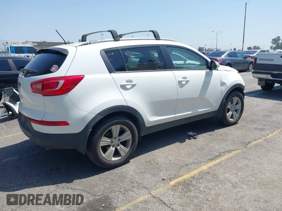 2013 Kia Sportage LX with VIN KNDPB3A23D7514304, listed as a IAAI auction lot 42544397 with 82,456 mi miles and . Bid and sale history available at DreamBid. Image 4.
