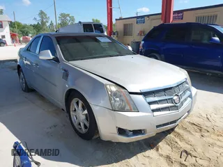 2009 Cadillac CTS AWD w/1SB with VIN 1G6DS57V190159989, listed as a IAAI auction lot 41897485 with 115,439 mi miles. Bid and sale history available at carsss.com. Image 1.