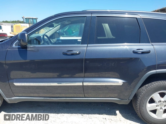 2012 Jeep Grand Cherokee Laredo with VIN 1C4RJEAG9CC223167, listed as a IAAI auction lot 42136098 with 152,715 mi miles. Bid and sale history available at carsss.com. Image 14.