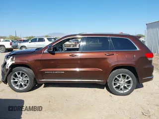 2015 Jeep Grand Cherokee Summit with VIN 1C4RJFJGXFC125131, listed as a IAAI auction lot 42475017 with 128,166 mi miles and . Bid and sale history available at DreamBid. Image 14.