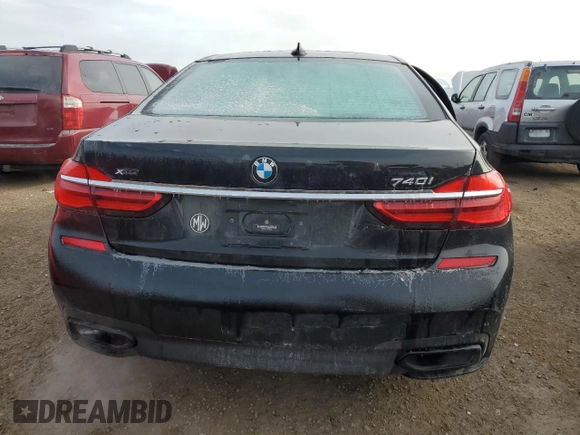 2019 BMW 7 Series 740i xDrive z VIN WBA7E4C50KGV28241, wystawiony jako Copart lot #87329774 z przebiegiem Nie podano mil oraz Szkoda całkowita • Salvage title. Historia ofert i sprzedaży dostępna na DreamBid. Obrazek 6.