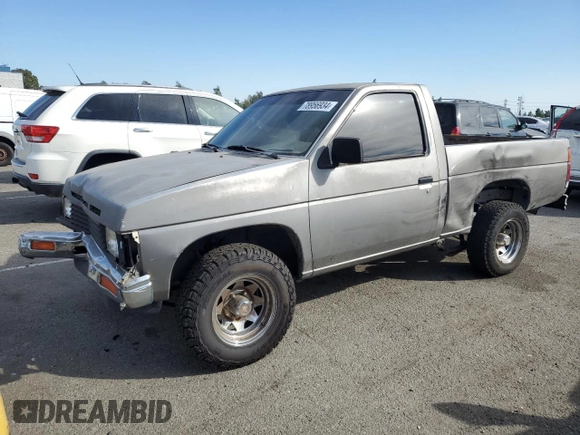 1987 Nissan Hardbody E z VIN JN6ND11SXHW014073, wystawiony jako Copart lot #78956934 z przebiegiem 381 885 mil mil oraz Szkody całkowita. Historia ofert i sprzedaży dostępna na DreamBid. Obrazek 1.