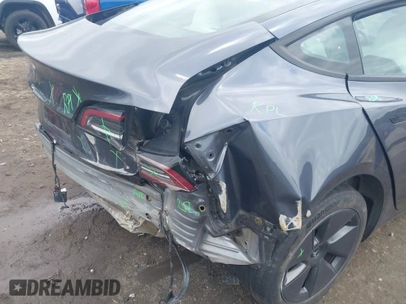 2023 Tesla Model 3 with VIN 5YJ3E1EAXPF628911, listed as a IAAI auction lot 42362410 with 25,387 mi miles and . Bid and sale history available at DreamBid. Image 6.